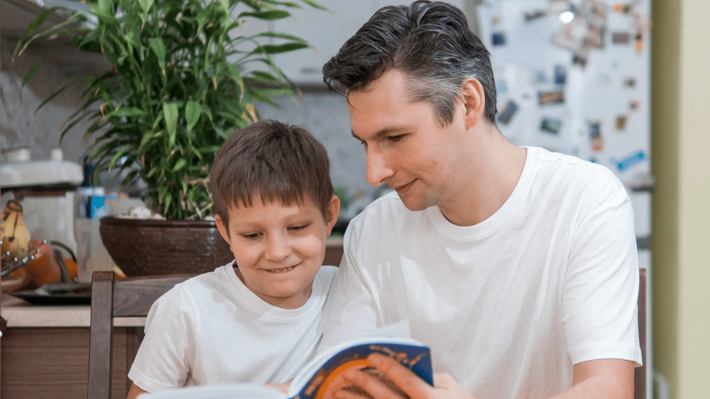 Man reading with child