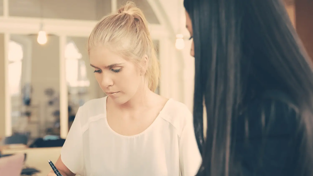 Woman assessing girl