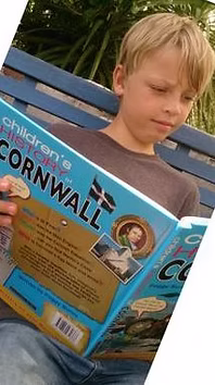 Boy reading Cornwall book